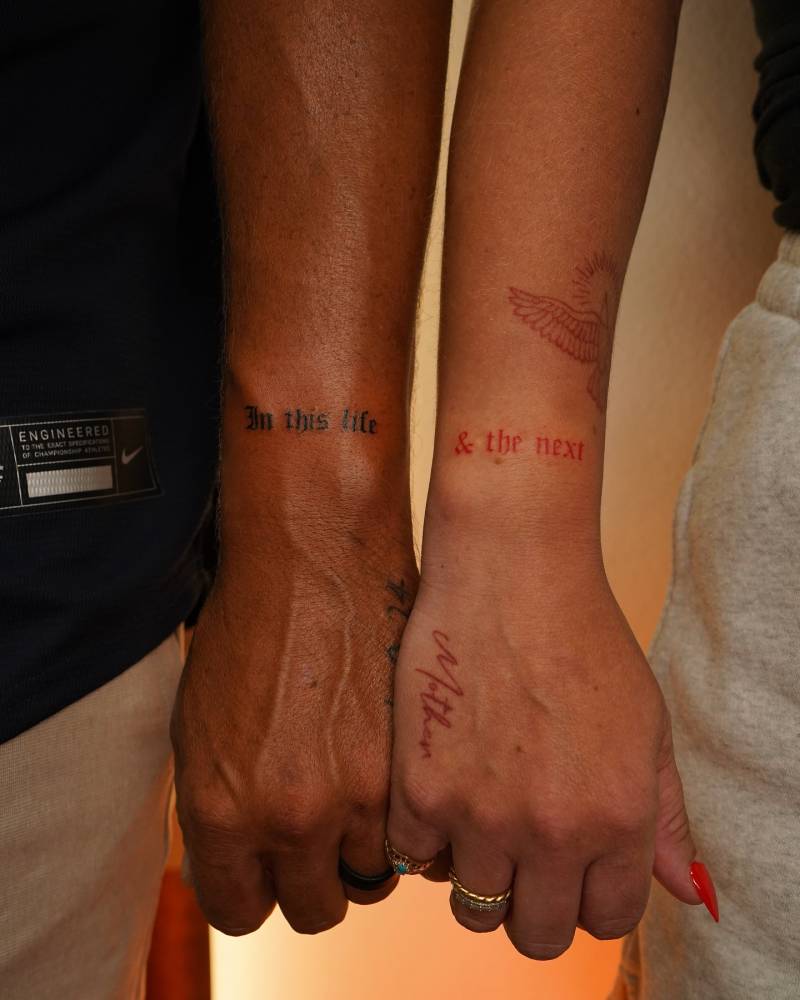 "In this life and the next" matching lettering tattoo for couple.