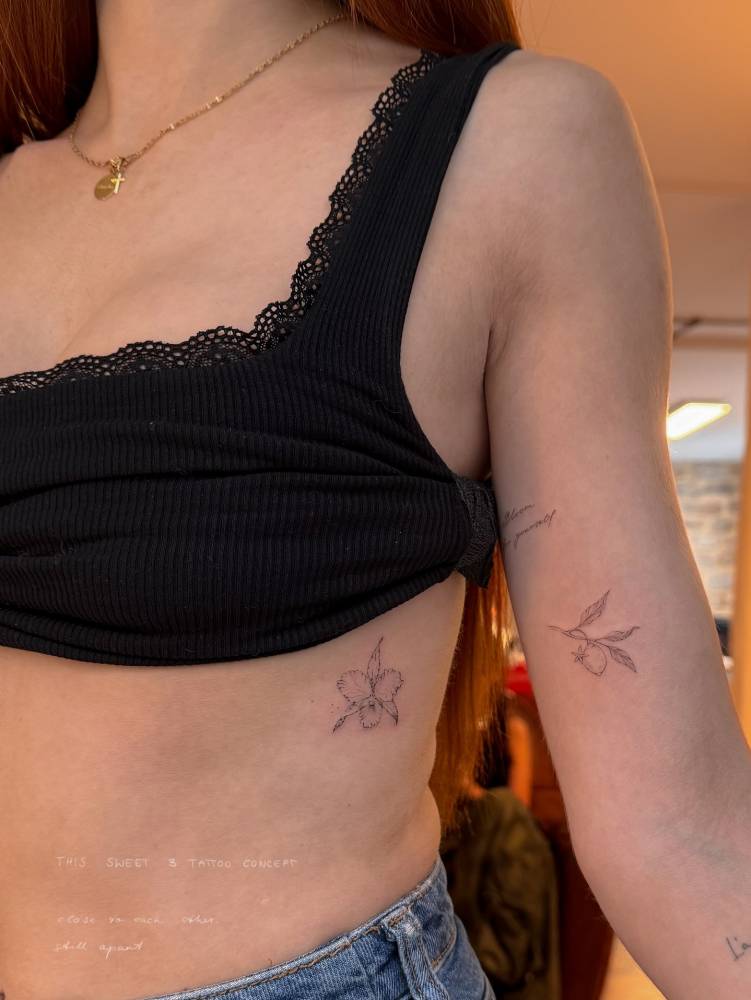 Orchid and lemon tattoos done in fine line style.