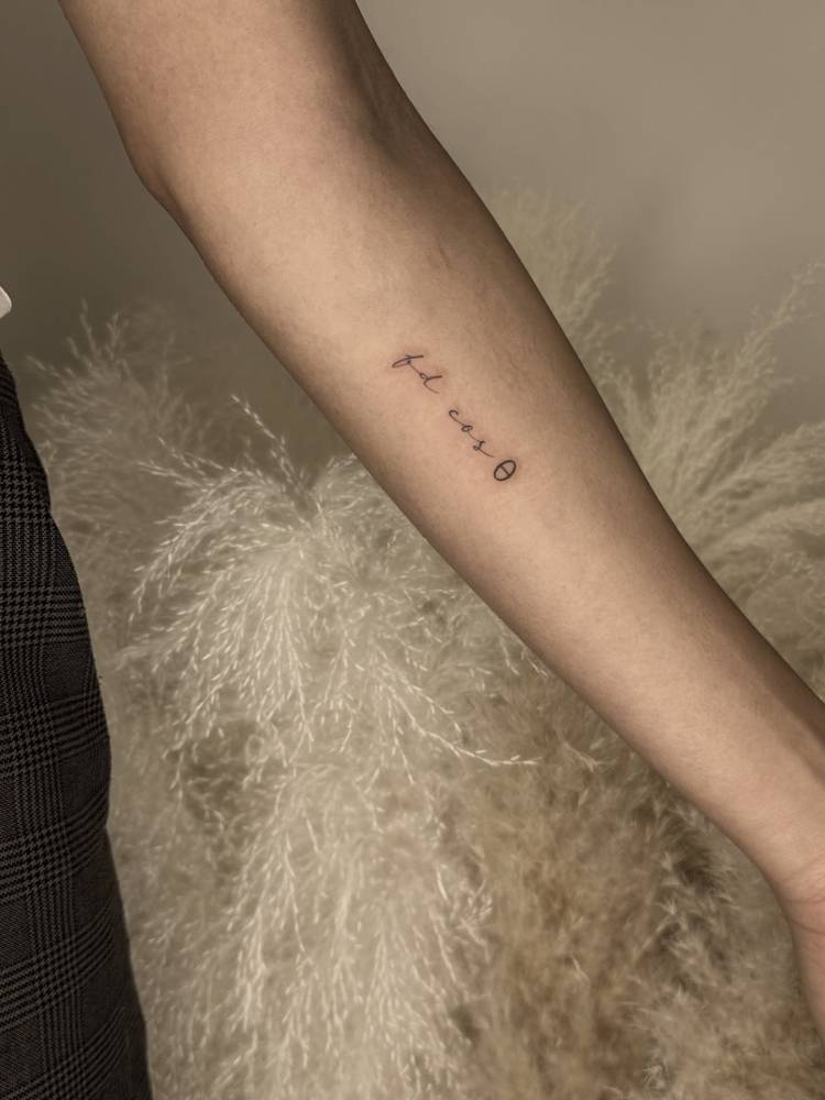 Equation tattoo located on the inner forearm.