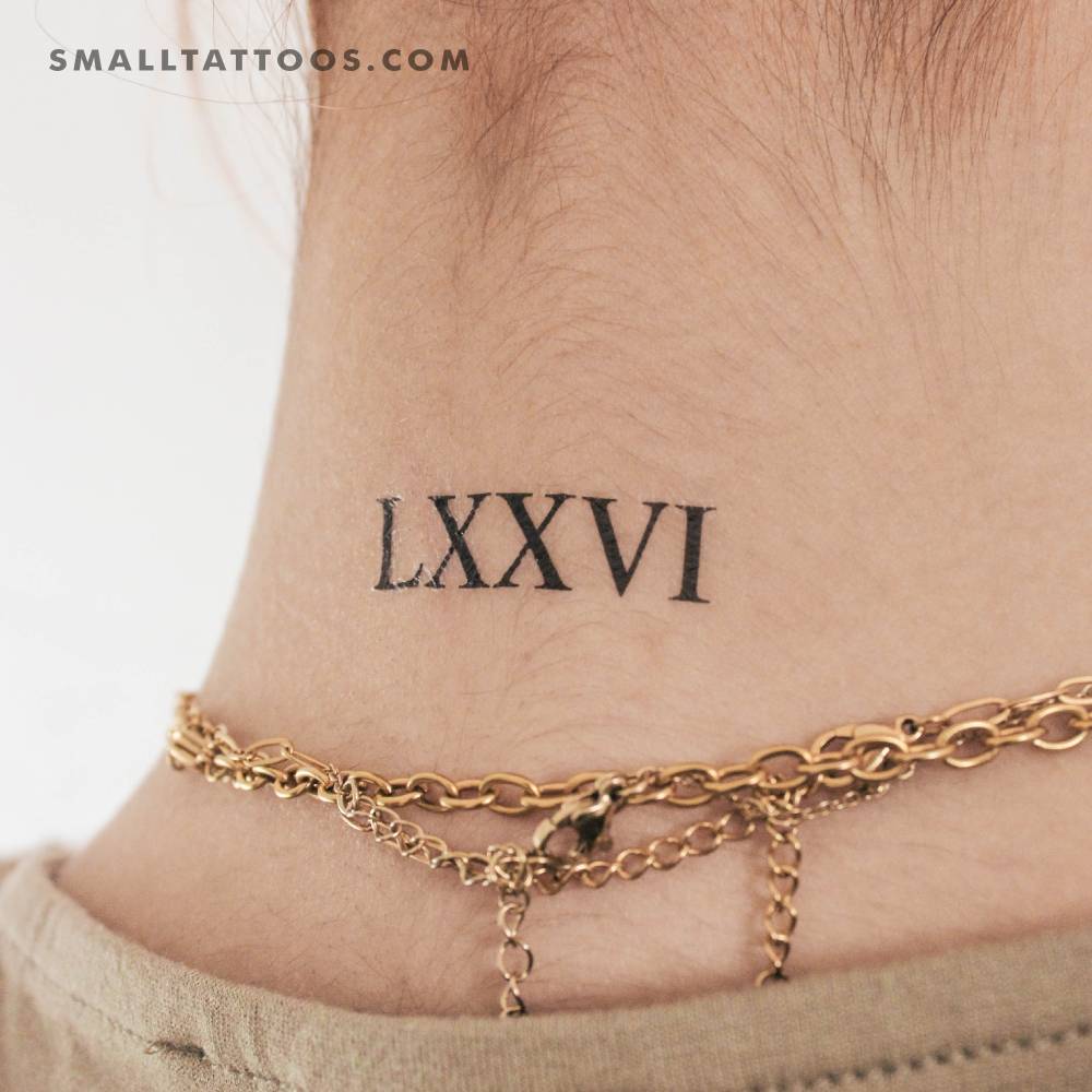 "LXXVI" temporary tattoo located on the back of the neck