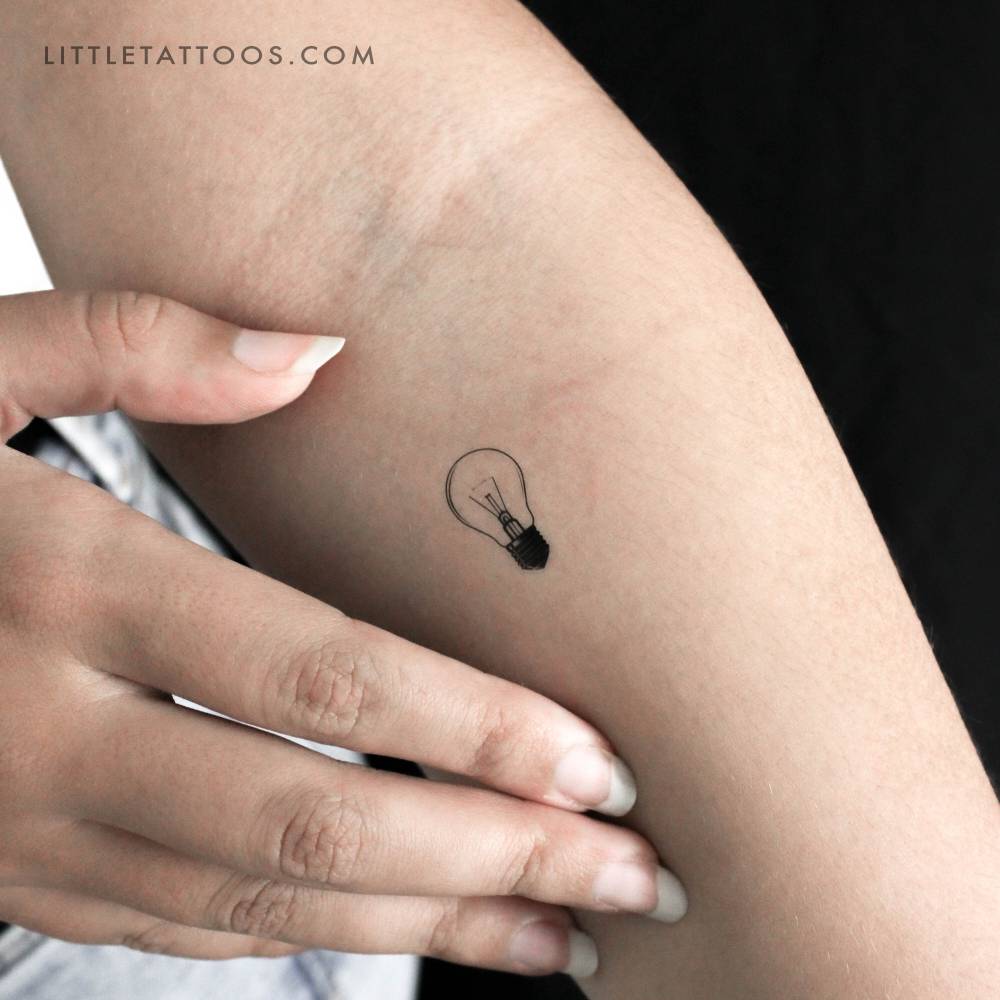 Light bulb temporary tattoo in illustrative style.