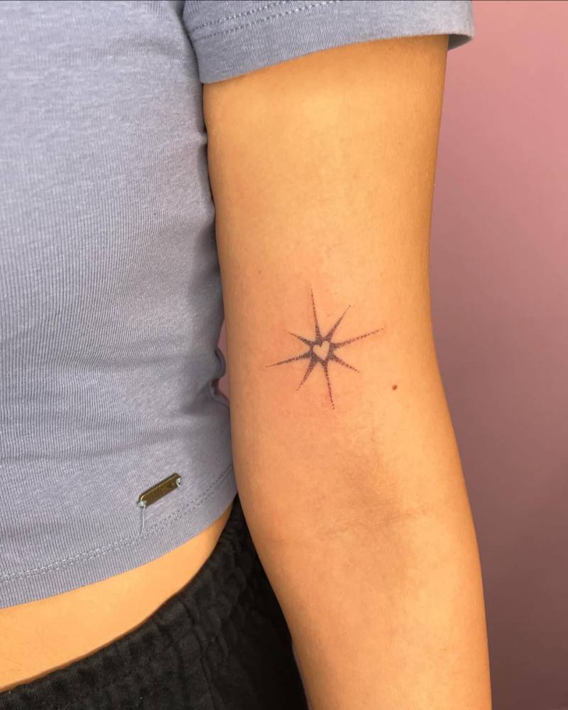 Spikey heart tattoo located on the bicep.