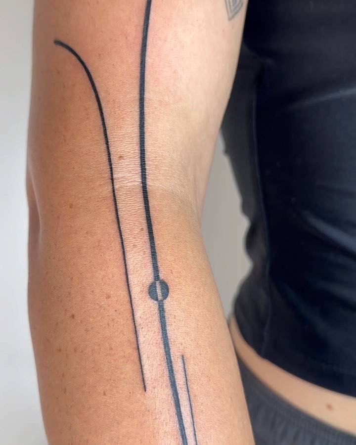 Line art style tattoo located on the arm.