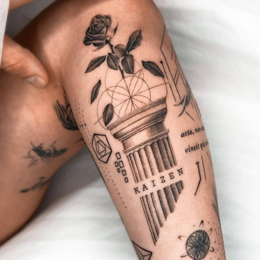 Column and rose tattoo located on the forearm, graphic style.