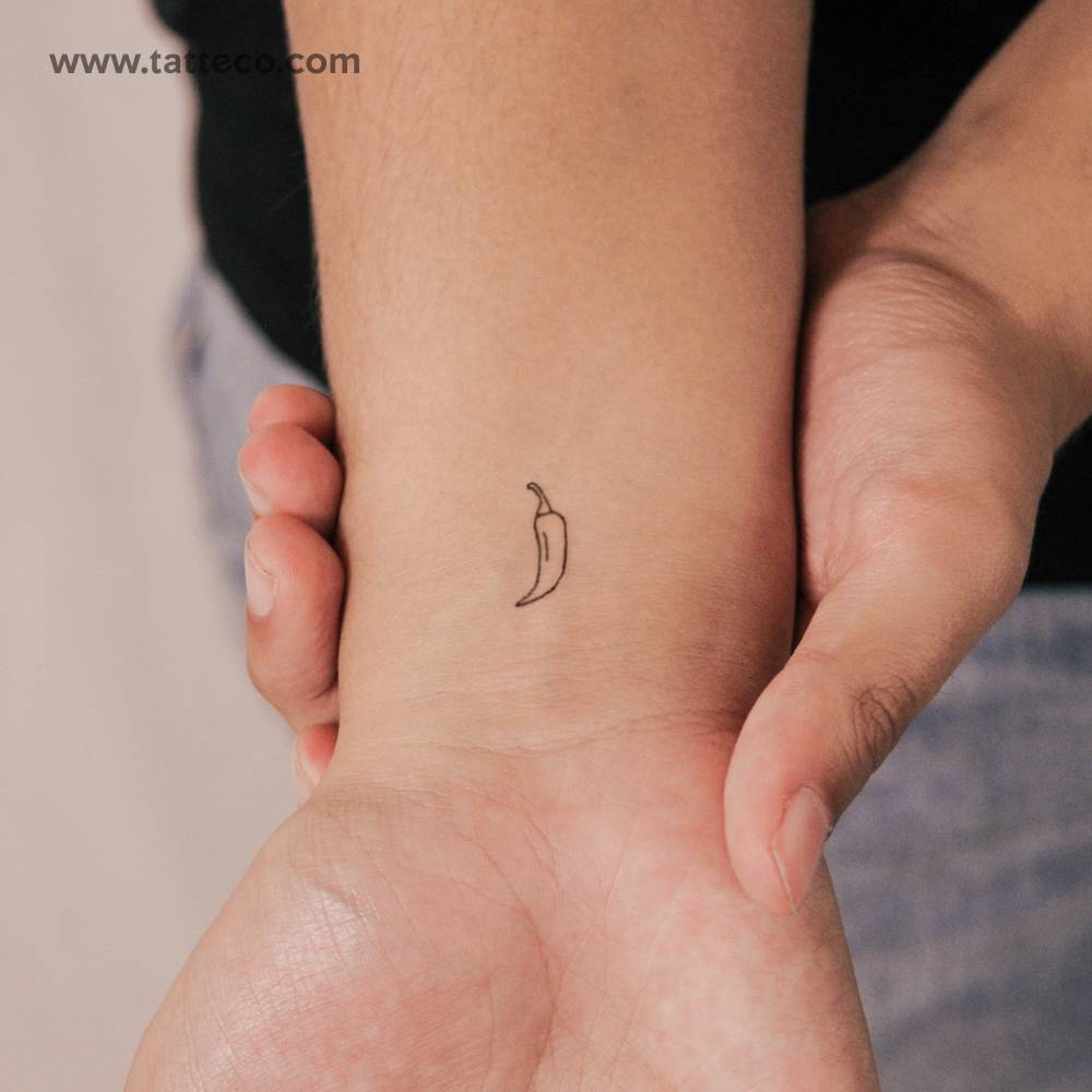 Fine line style minimalistic chili semi-permanent tattoo located on the wrist.
