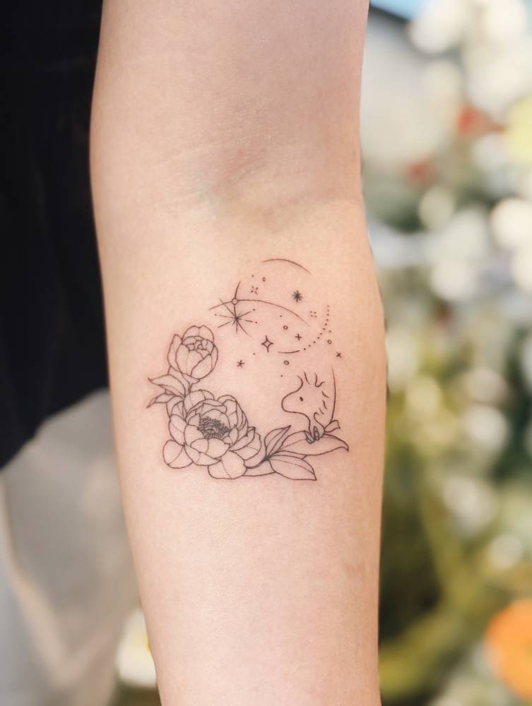 Woodstock and peonies tattooed on the inner forearm, fine line style.