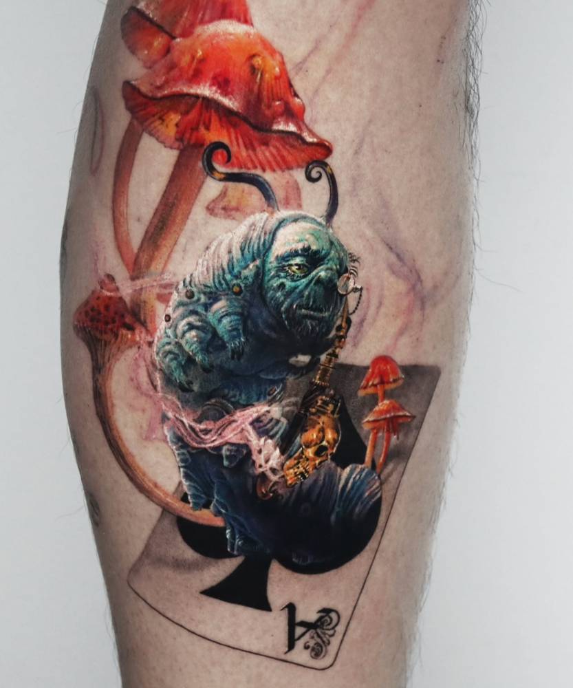 Tim Burton's Blue Caterpillar tattoo located on the calf.