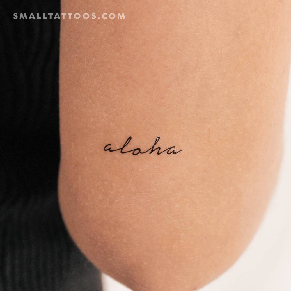 Handwritten font word 'aloha' temporary tattoo located on the tricep.
