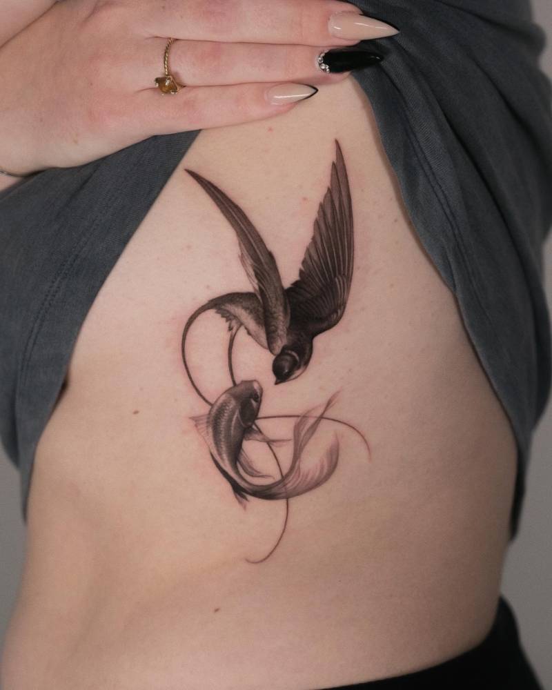 Swallow and koi fish tattoo in micro-realistic style.