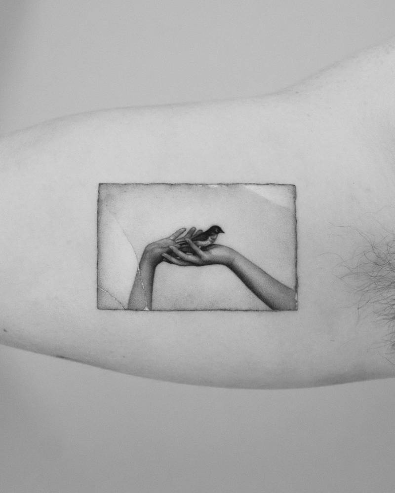 Micro-realistic style Masao Yamamoto's artwork tattooed on the inner arm.