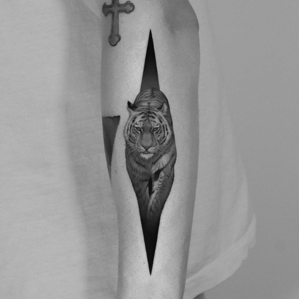 Micro-realistic style tiger tattoo done on the forearm.