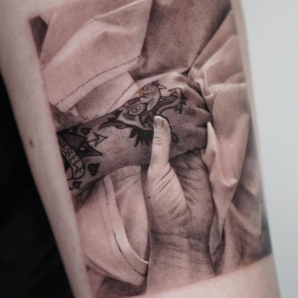 Memorial piece for her brother - Micro-realistic holding hands tattoo