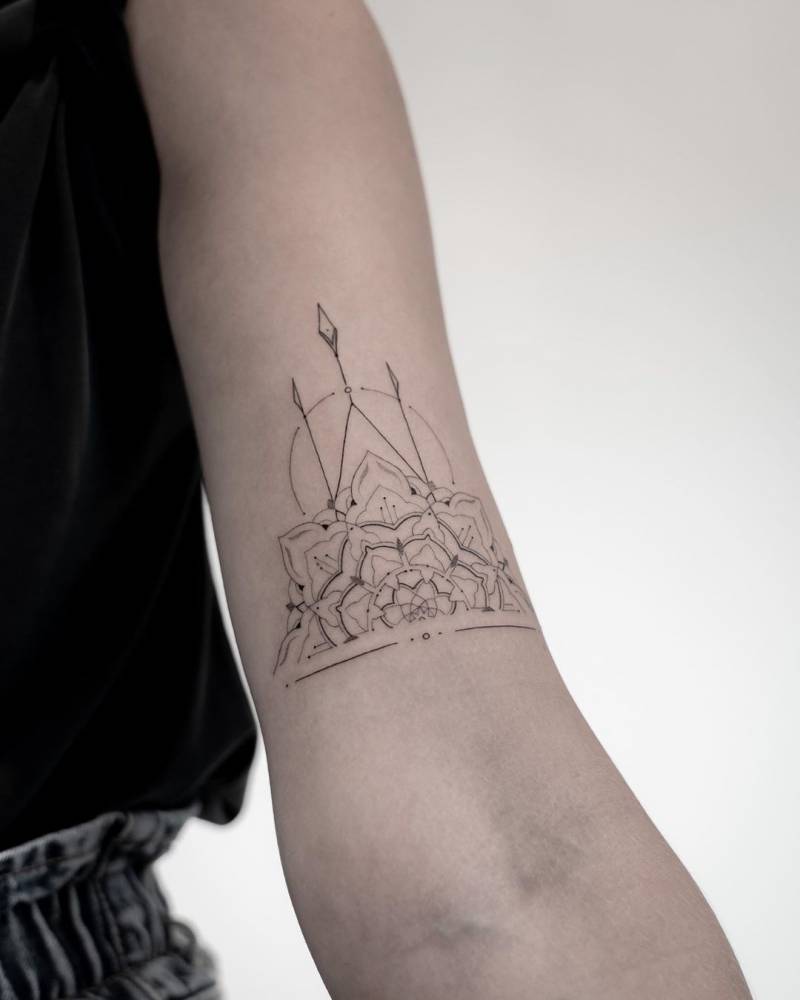 Half mandala tattoo on the bicep