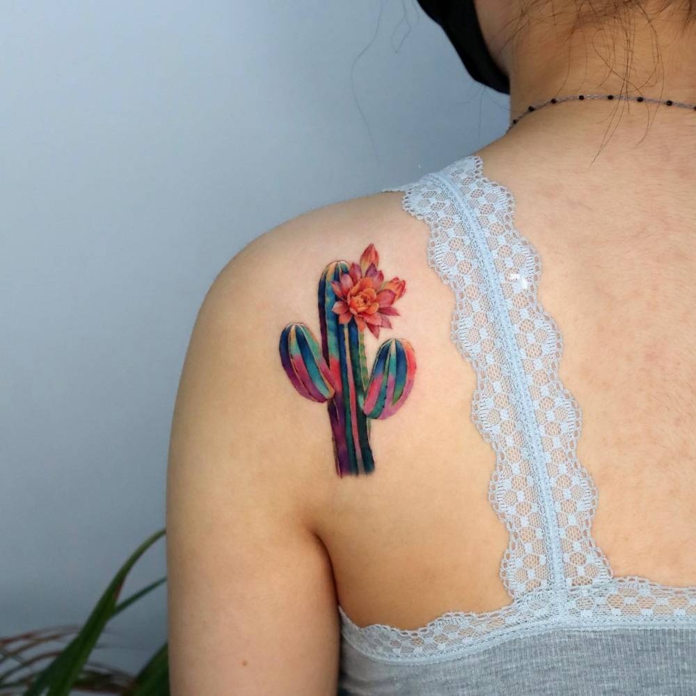 Realistic style saguaro tattoo located on the shoulder blade.