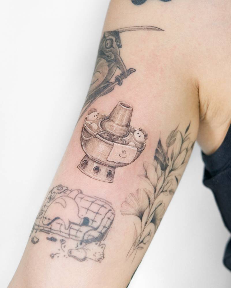 Onsen hotpot tattoo located on the bicep.