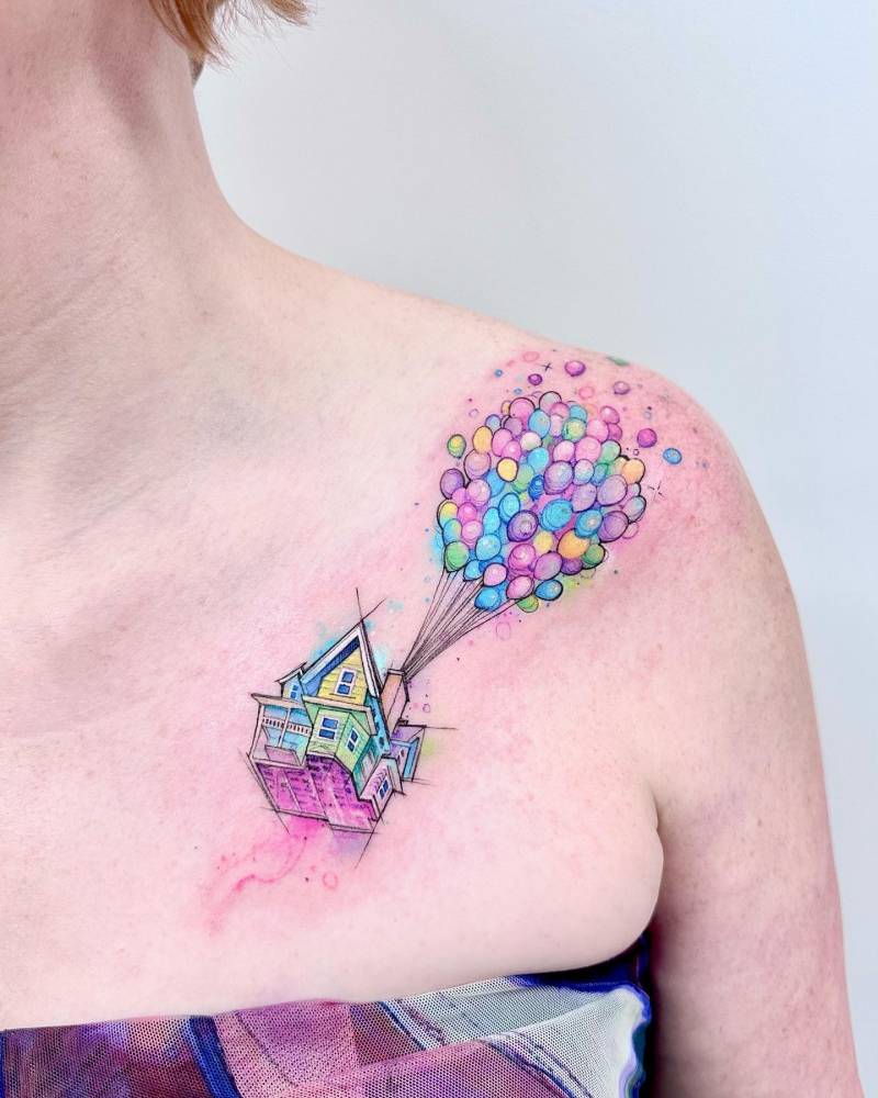 Watercolor style Up house tattoo located on the shoulder.