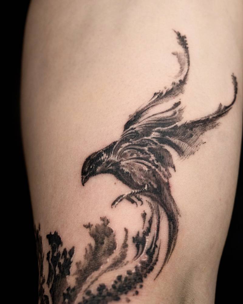 Sparrow tattoo located on the upper arm, done in blackwork style.