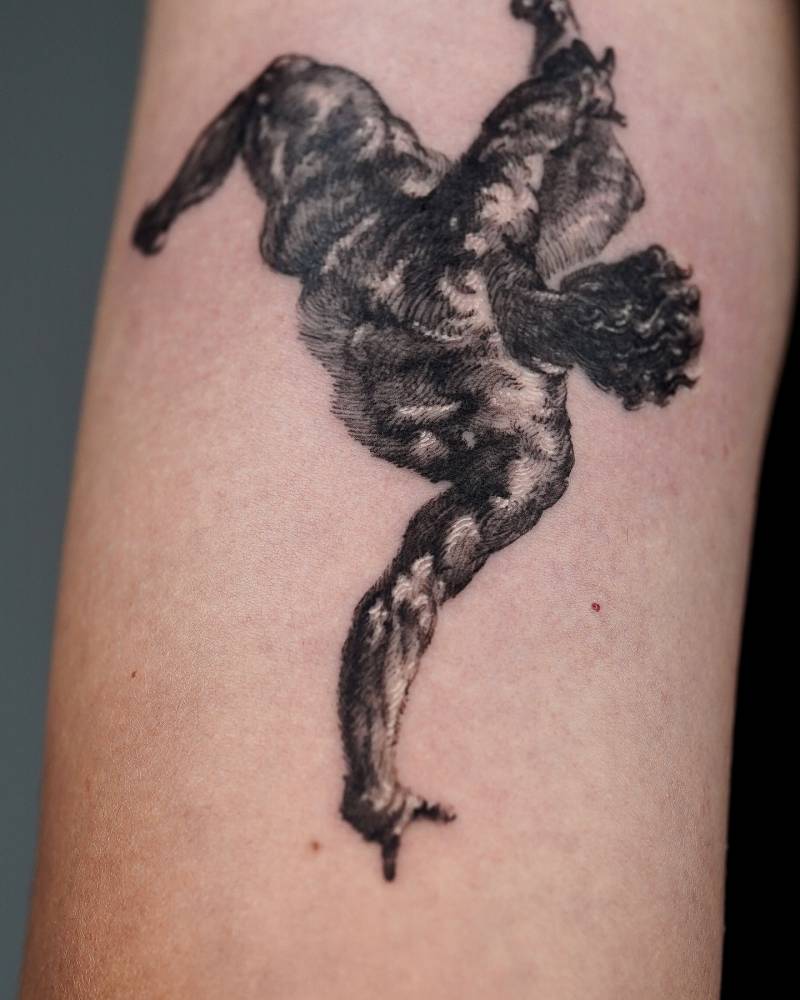 Phaeton tattoo located on the tricep, blackwork style.