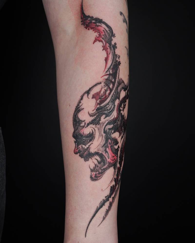 Devil portrait tattoo located on the forearm, done in illustrative style.