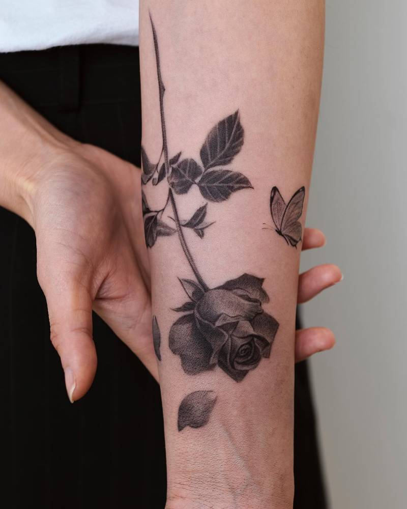 Black and grey rose tattoo done on the inner forearm.