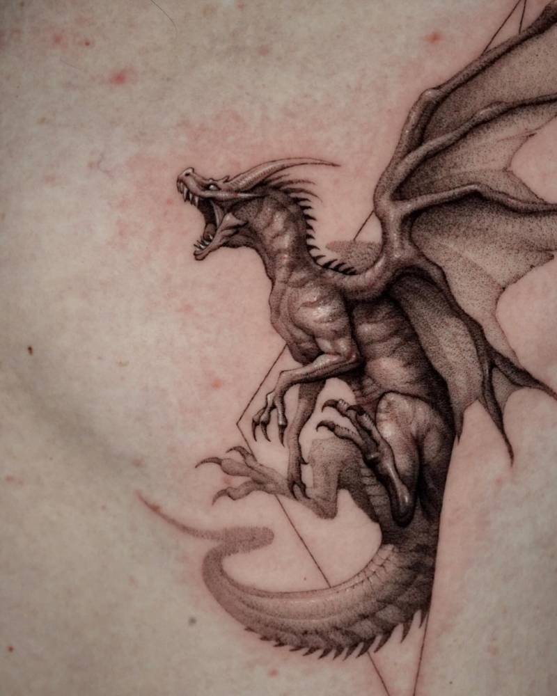 Micro-realistic style dragon tattoo located on the rib.