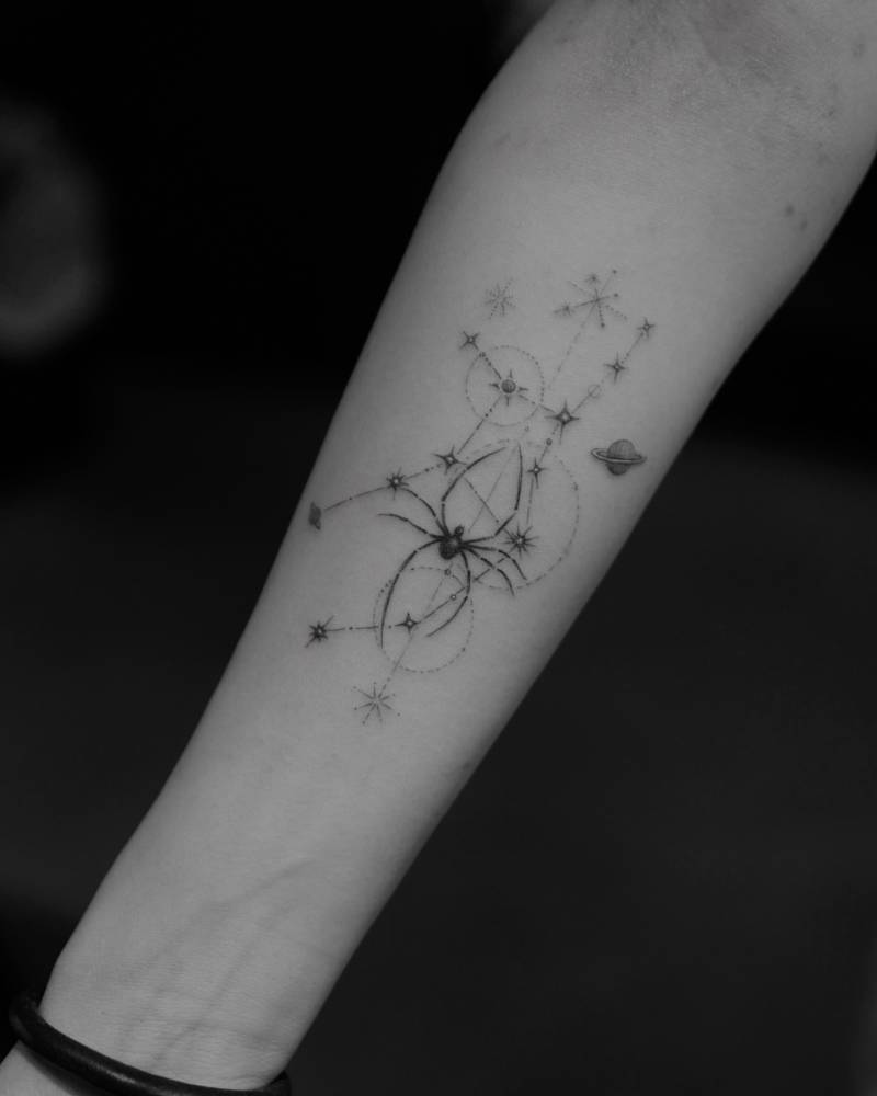 Virgo constellation and spider tattoo located on the inner forearm.