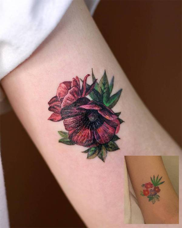 Anemone flower cover up tattoo located on the inner arm, watercolor style.