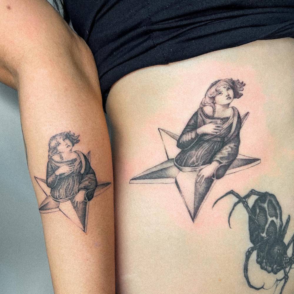 Matching tattoo for mother and daughter based on the album cover “Mellon Collie and The Infinite Sadness” from Smashing Pumpkins.