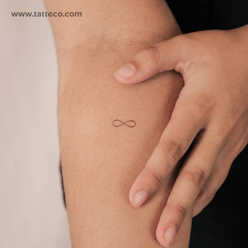 Small minimalistic infinity symbol semi-permanent tattoo.