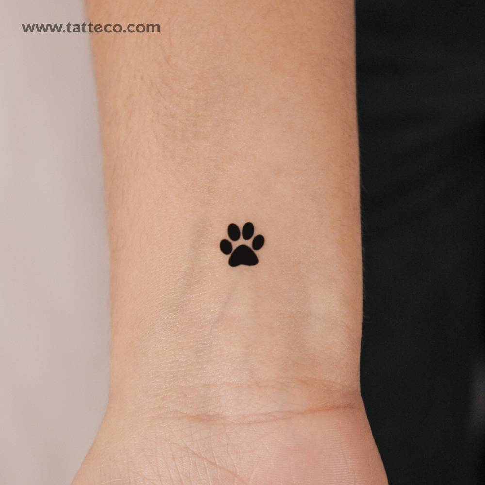 Dog paw print semi-permanent tattoo located on the wrist.