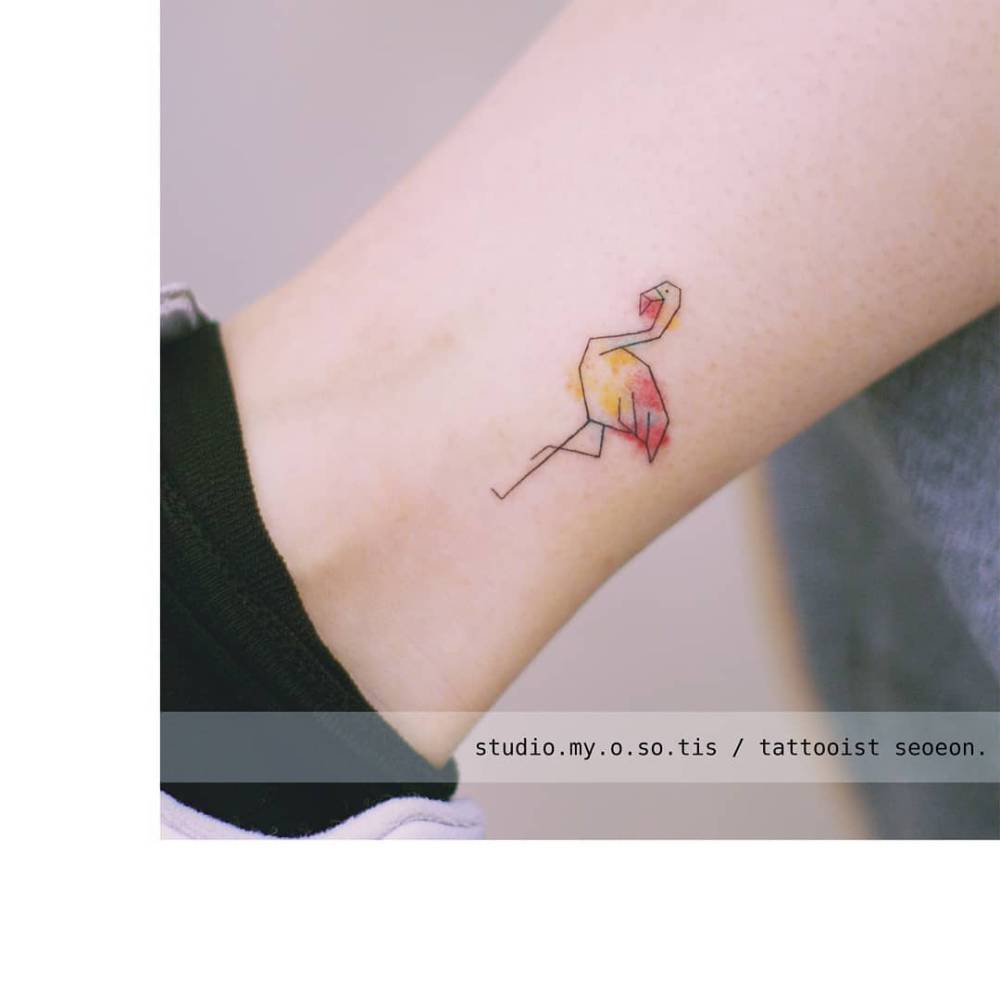 Watercolor style flamingo tattoo located on the ankle.