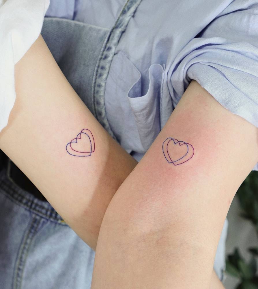 Matching fine line hearts tattoo for best friends.