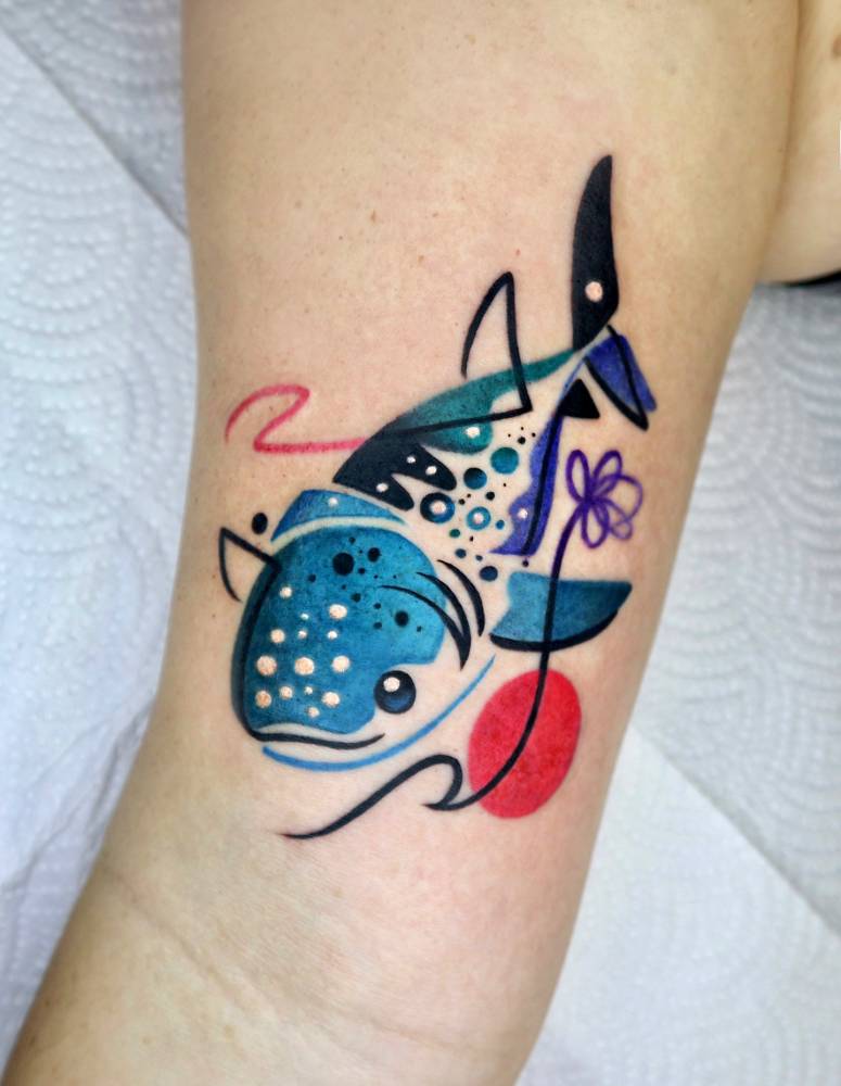Pop art style whale shark tattoo located on the inner arm.