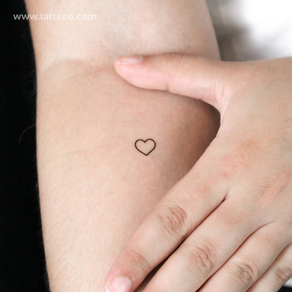 Small minimalist heart outline semi-permanent tattoo.