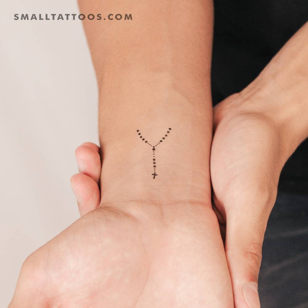 Minimalistic little rosary temporary tattoo done on the wrist.