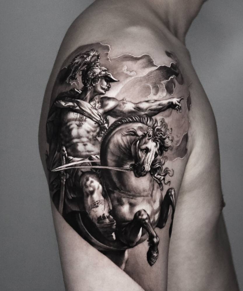 Warrior and horse tattoo located on the upper arm, black and grey style.