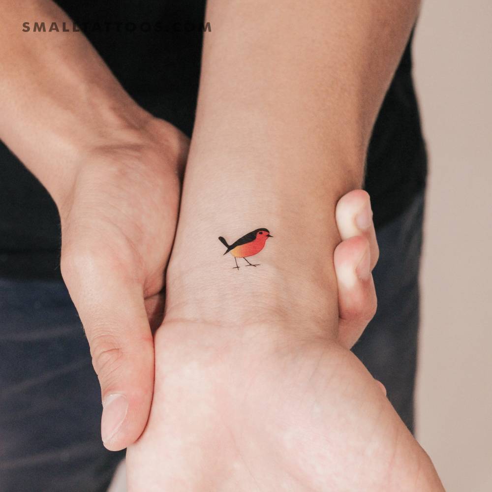 Little robin temporary tattoo located on the wrist.