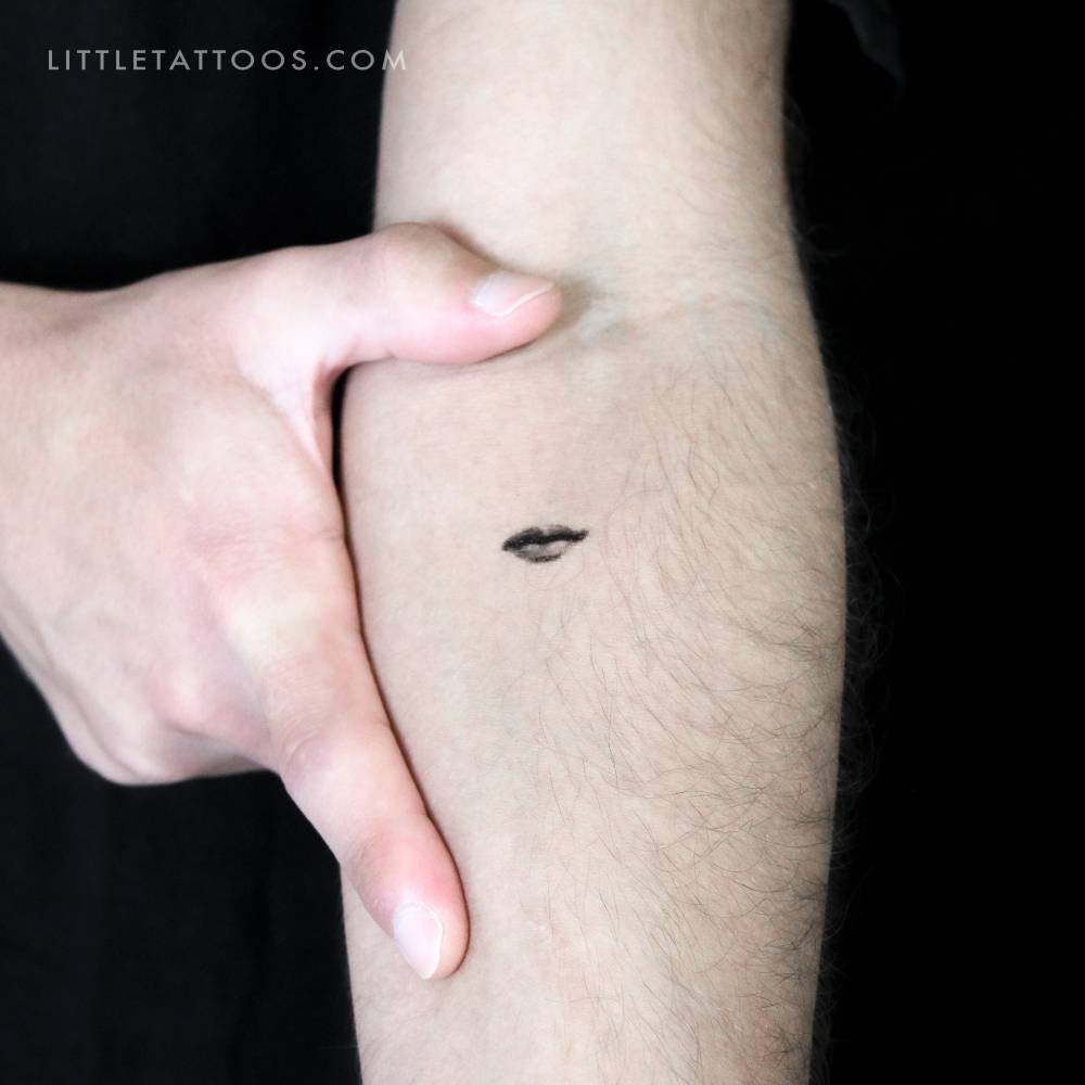 Micro-realistic style mouth temporary tattoo located on the inner forearm.