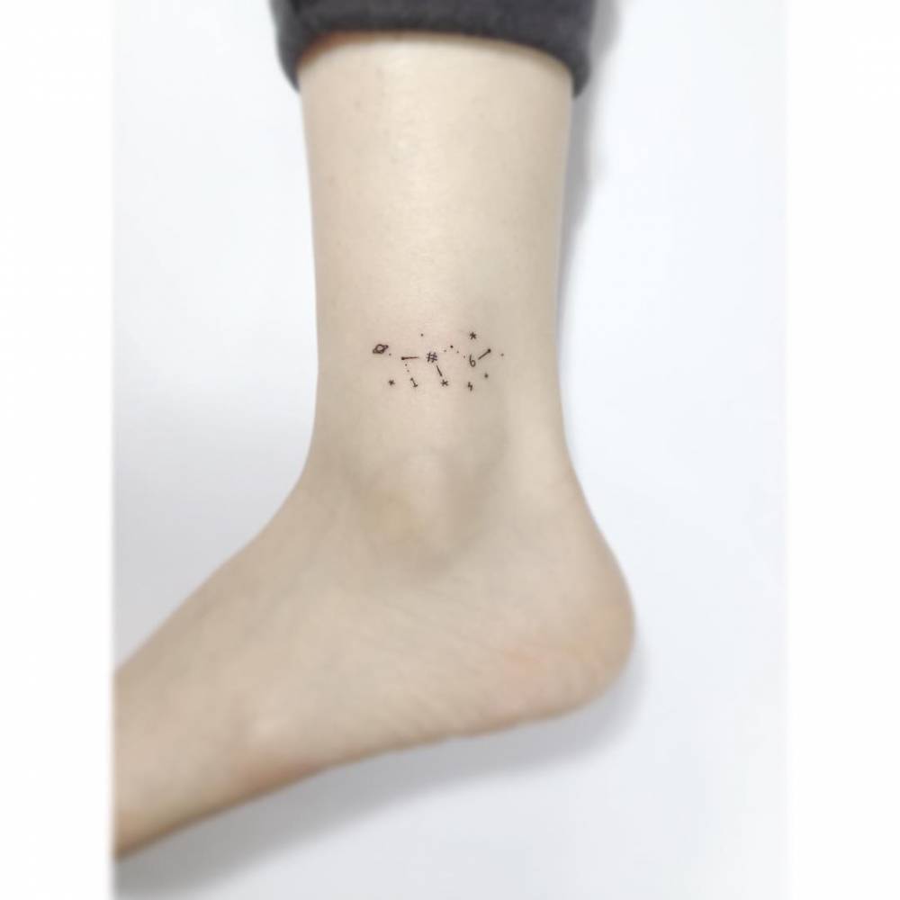 Minimalistic style Leo constellation tattoo located on the ankle.