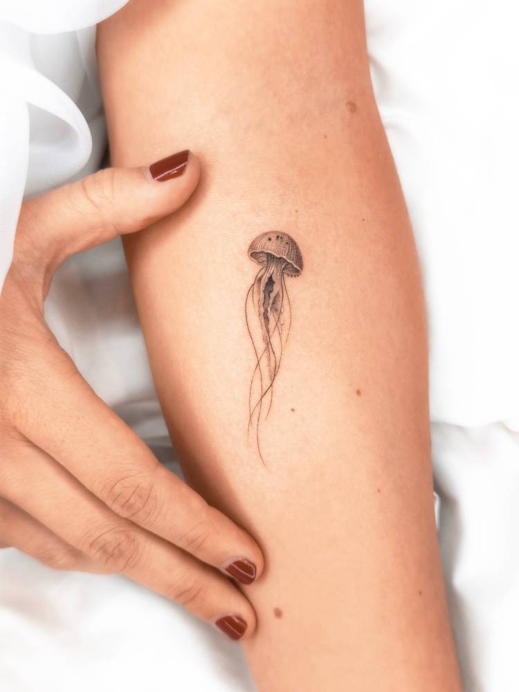 Micro-realistic style jellyfish tattoo done on the inner forearm.