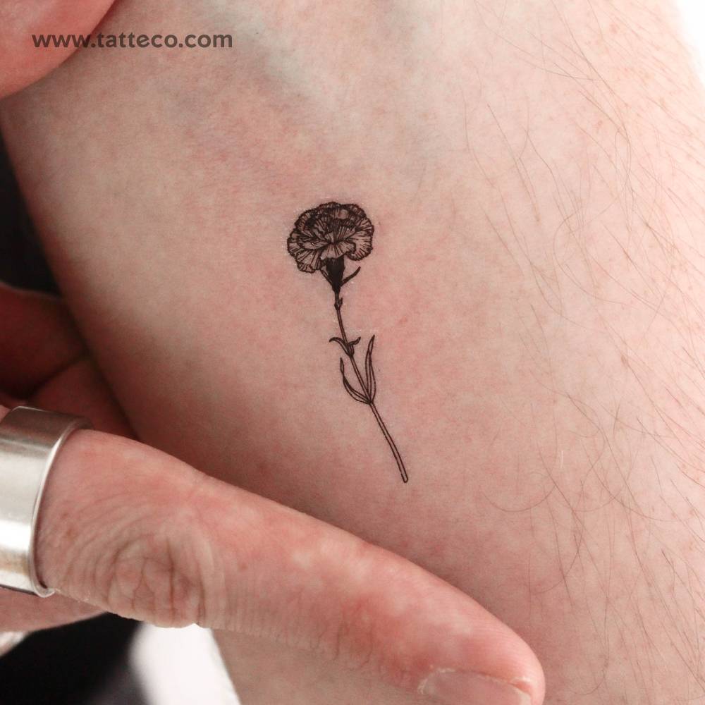 Little carnation temporary tattoo located on the inner forearm.