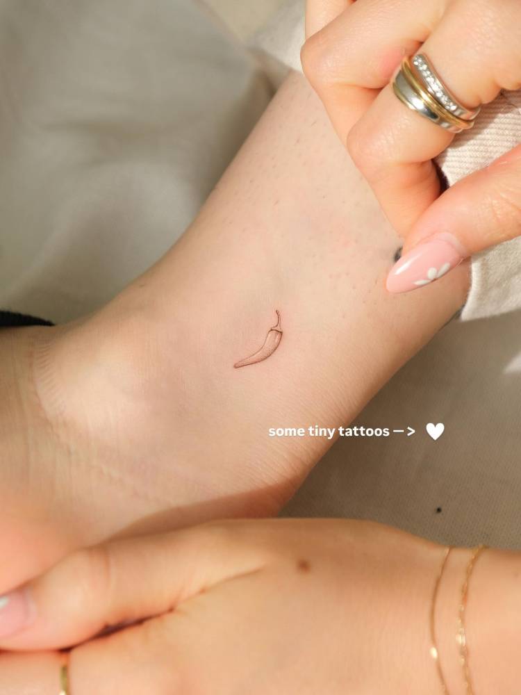 Single needle chili pepper tattoo located on the ankle.