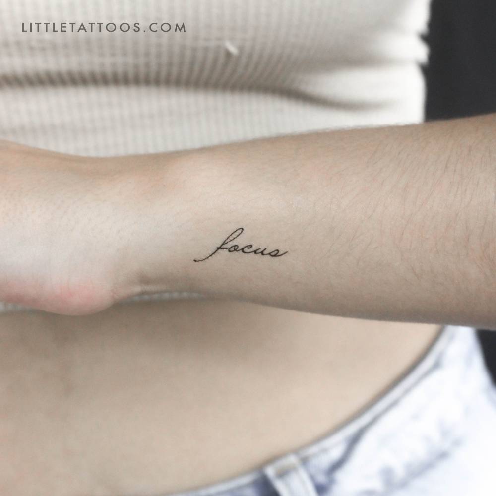 Handwritten font word "focus" temporary tattoo.