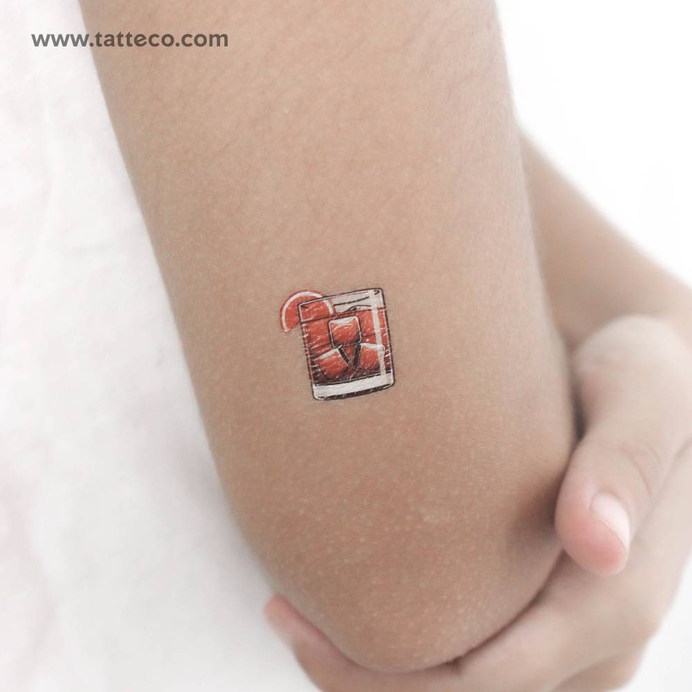 Negroni temporary tattoo located on the tricep.