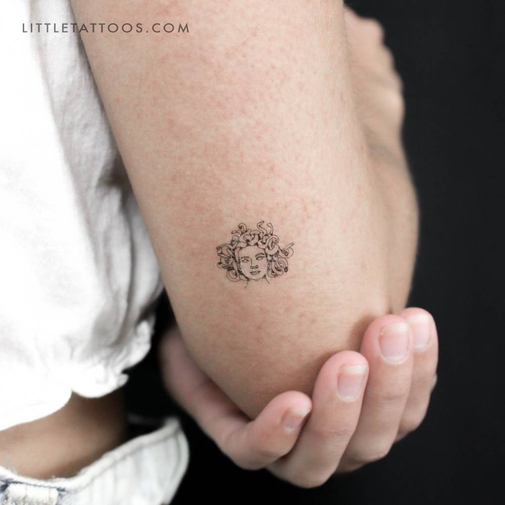 Small Medusa portrait temporary tattoo located on the tricep.