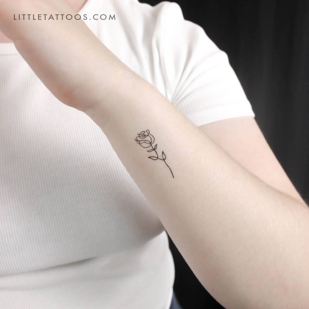 Single line rose temporary tattoo located on the wrist.