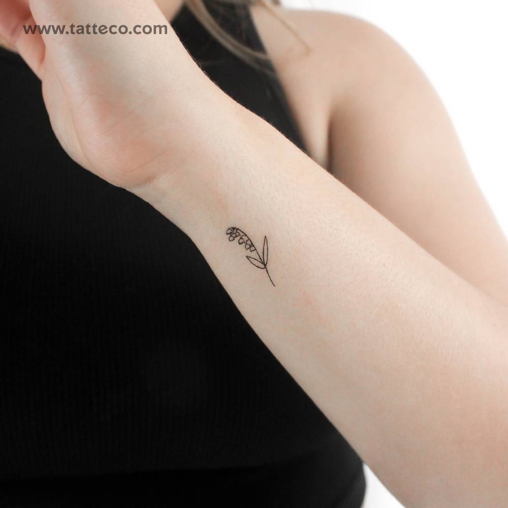Minimalist lily of the valley temporary tattoo located on the wrist.