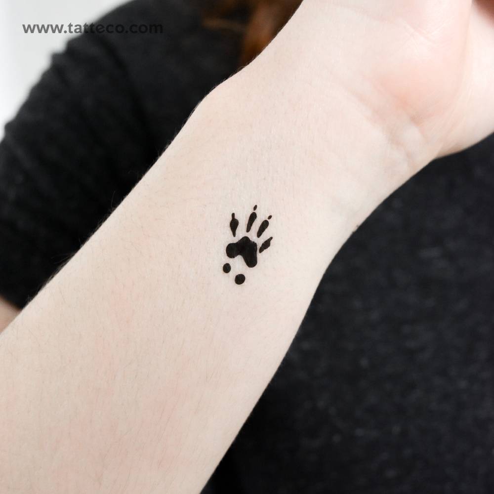 Squirrel front paw print temporary tattoo located on the wrist.