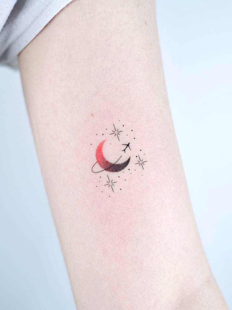 Around the moon tattoo located on the bicep.