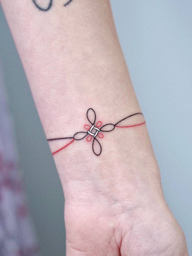 Norigae wristband tattoo.